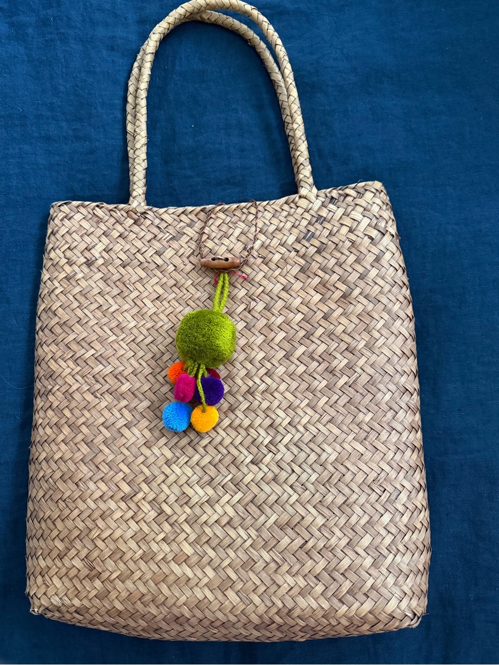 Woven Straw Tote Bag with Colorful Pom Accent - Natural